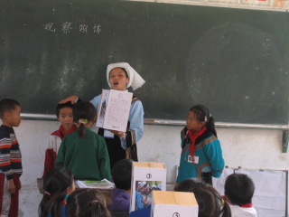 A Shui Ethnic Minority teacher teaching in school.
